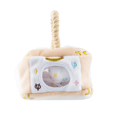 Plush interactive dog toy shaped like a designer-style handbag with a beige and white body, rope handle, and “Chewy Vuiton Paris” label, including three matching plush balls for hide-and-seek play.