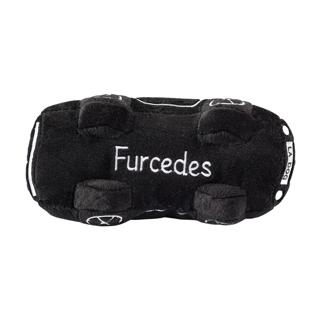 Black plush dog toy shaped like a luxury sports car with embroidered window, wheel, and headlight details. Soft squeaky toy for pets.