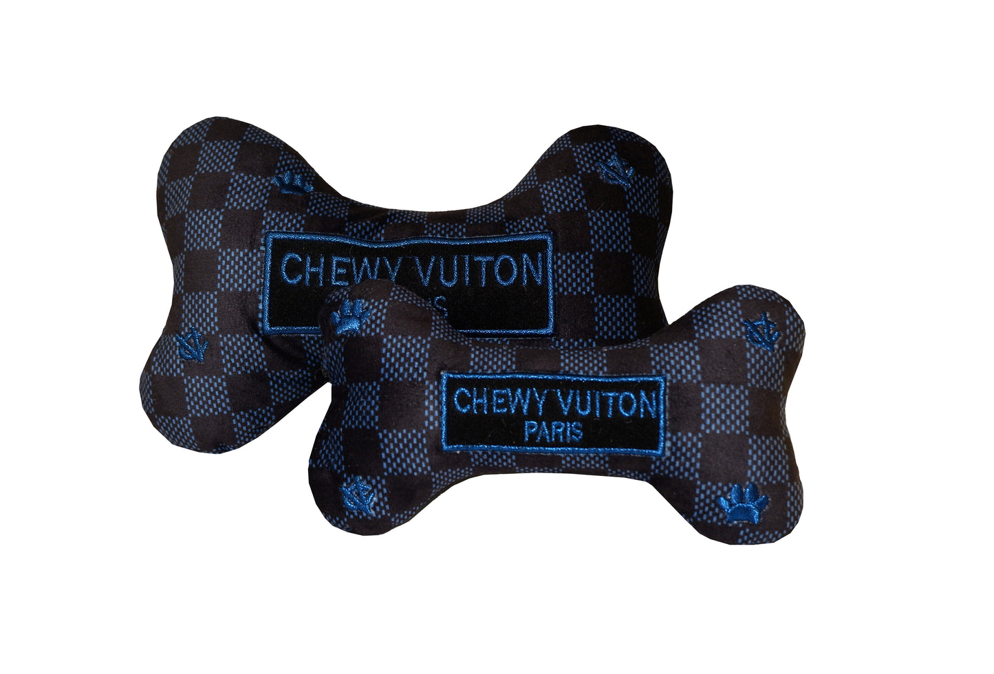 Plush dog bone toy in black and blue check pattern with blue embroidered icons and a “Chewy Vutton Paris” label. Luxury designer-style squeaky chew toy for pets.