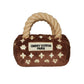Plush luxury dog handbag toy in brown velvet with rope handles and embroidered gold icons, featuring a “Chewy Vutton Paris” label. Soft squeaky designer-style chew toy for pets.