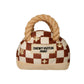 Luxury plush dog handbag toy with brown check pattern, rope-style handles, and “Chewy Vutton Paris” label. Soft squeaky designer-style chew toy for pets.