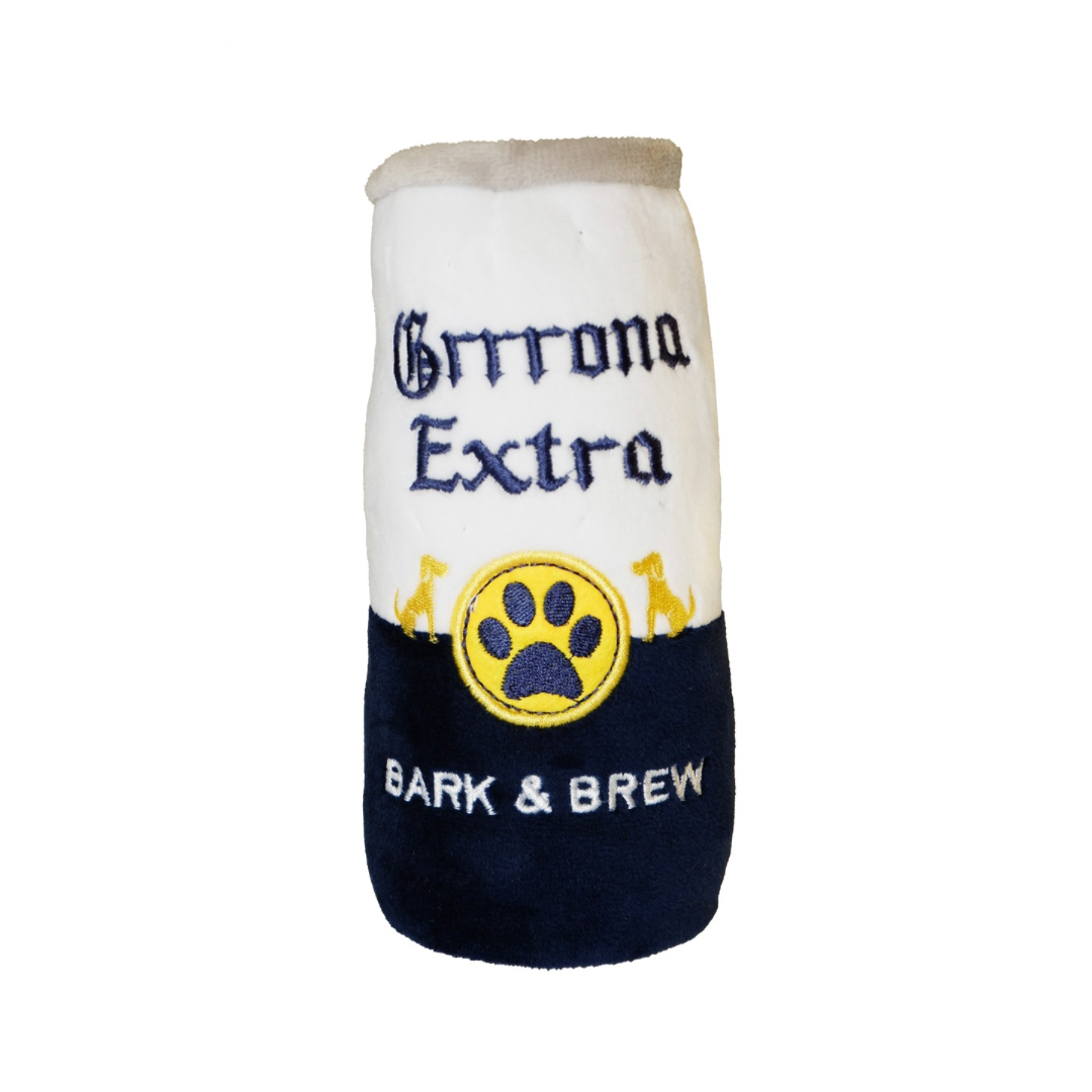 A soft plush dog toy designed like a beer can with the text “Grrrona Extra” and “Bark & Brew,” featuring a yellow paw print logo and dog silhouettes.