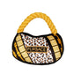 Plush luxury dog handbag toy with gold rope handle and black, leopard, and gold patterned design featuring a “Fursace” label. Designer-style squeaky chew toy for pets.