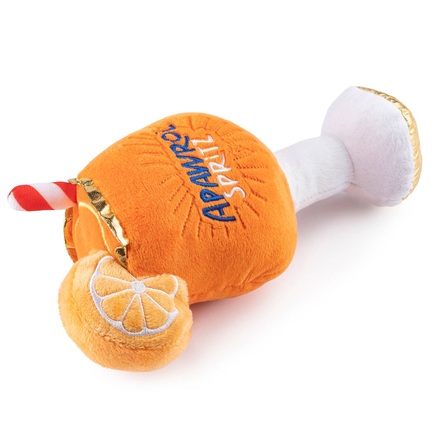 Plush dog toy shaped like an Apawrol Spritz cocktail glass with an orange slice and straw, featuring embroidered details. Soft squeaky novelty chew toy for pets.