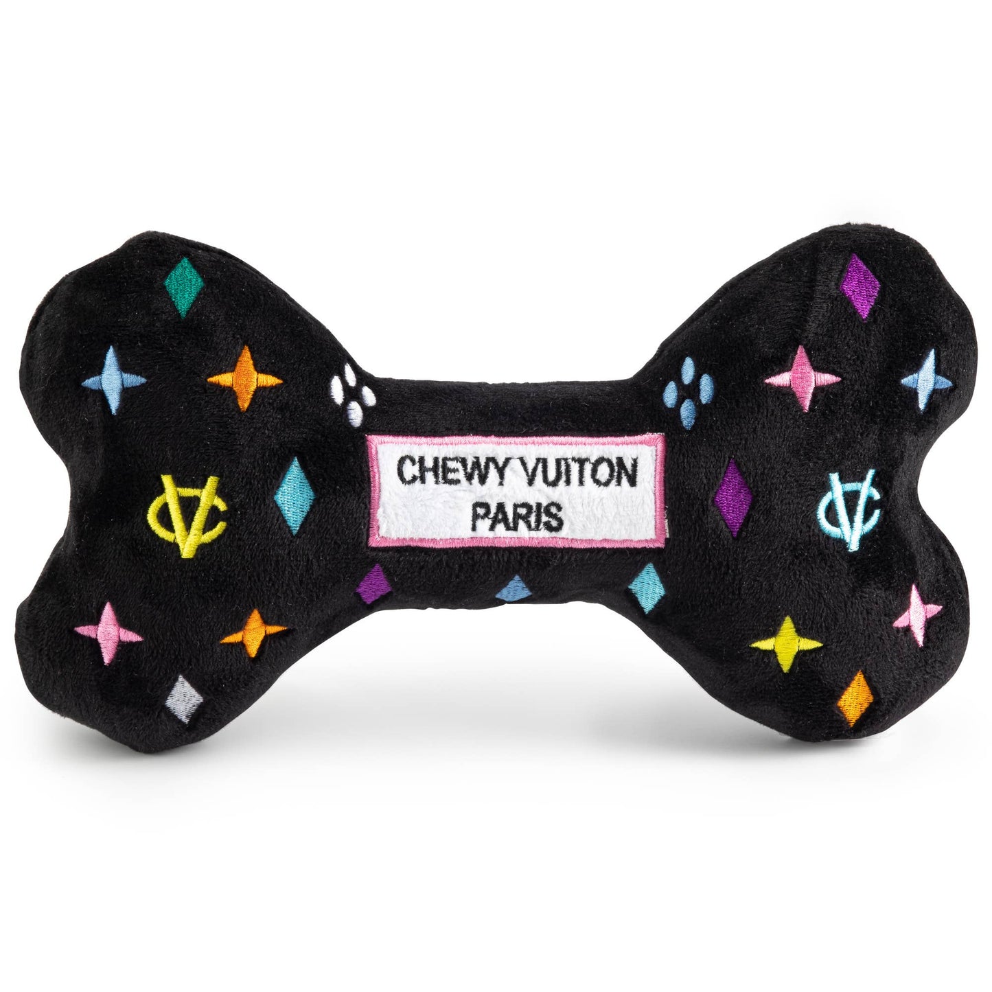Black plush dog bone toy with colorful embroidered designer-style icons and a “Chewy Vuiton Paris” label. Soft luxury squeaky chew toy for pets.