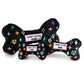 Black plush dog bone toy with colorful embroidered designer-style icons and a “Chewy Vuiton Paris” label. Soft luxury squeaky chew toy for pets.