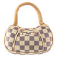 Two plush dog toys designed like Chewy Vuiton Paris handbags, featuring a beige and grey checkered pattern with soft handles, shown in large and small sizes.