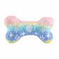 Pastel rainbow plush dog bone toy in pink, blue, and yellow gradient with white embroidered icons and a “Chewy Vuiton Paris” label. Soft luxury squeaky chew toy for pets.