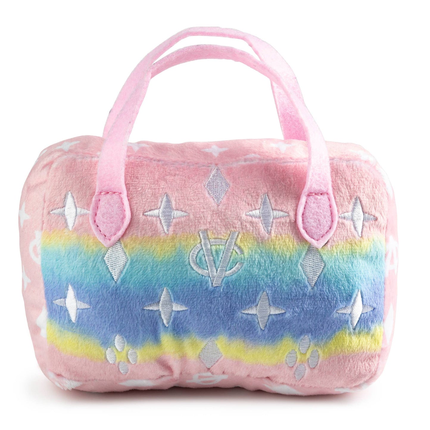 Plush dog toy shaped like a designer handbag with pink handles and a pastel rainbow gradient featuring embroidered icons and a “Chewy Vuiton Paris” label. Soft luxury squeaky chew toy for pets.