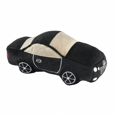 Black plush dog toy shaped like a luxury sports car with embroidered window, wheel, and headlight details. Soft squeaky toy for pets.