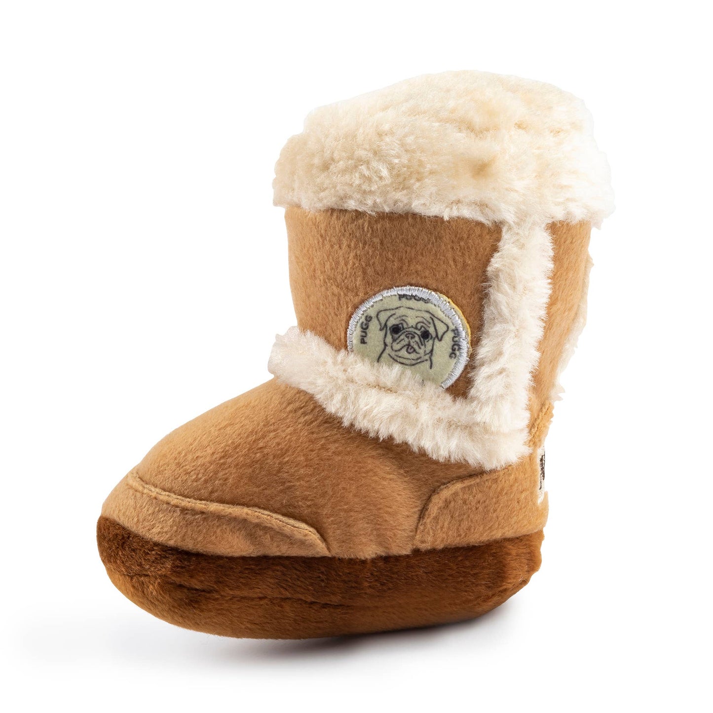 Plush dog toy shaped like a cozy winter boot with faux fur lining and an embroidered pug badge—cute chew toy for dogs.
