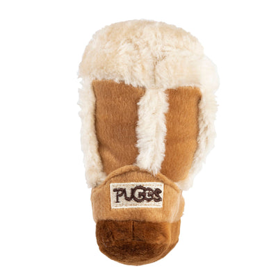 Plush dog toy shaped like a cozy winter boot with faux fur lining and an embroidered pug badge—cute chew toy for dogs.